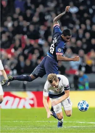  ?? PHOTO: REUTERS ?? Timmmberrr . . . Chelsea striker Harry Kane trips in front of PSV Eindhoven’s Pablo Rosario during their Champions League clash at Wembley yesterday. Kane scored both goals in his side’s 21 win.