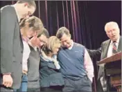  ?? Curtis Compton
Associated Press ?? Rick Santorum and members of his family pray at a campaign stop in Cumming, Ga.