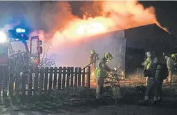  ?? Picture: Neil Henderson. ?? Three fire crews battle to bring blaze at former Rosyth Juniors FC club building in Rosyth under control.