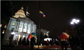  ?? Isaiah Downing /Reuters ?? People gather at the Colorado state capitol for a candleligh­t vigil on Wednesday. Photograph: