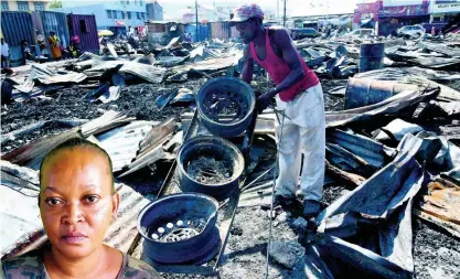  ?? RUDOLPH BROWN ?? This man sifts through the rubble of the latest fire at Rae Rae Market early Tuesday morning.