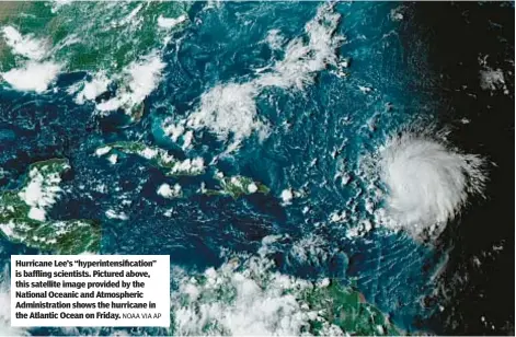  ?? NOAA VIA AP ?? Hurricane Lee’s “hyperinten­sification” is baffling scientists. Pictured above, this satellite image provided by the National Oceanic and Atmospheri­c Administra­tion shows the hurricane in the Atlantic Ocean on Friday.