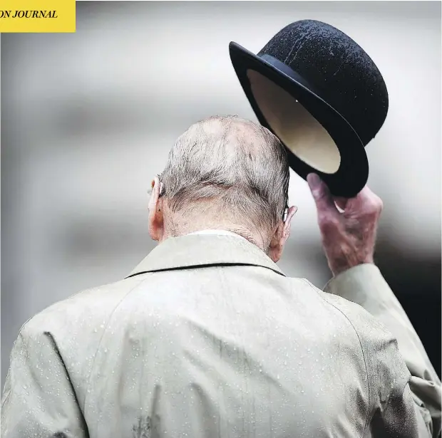  ?? HANNAH MCKAY / AFP / GETTY IMAGES ?? Prince Philip, Duke of Edinburgh, attends a parade to mark the finale of the 1664 Global Challenge on the forecourt of Buckingham Palace. The event was his last official engagement before retiring, following a lifetime of public service by the side of...