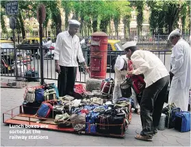  ??  ?? Lunch boxes are sorted at the railway stations