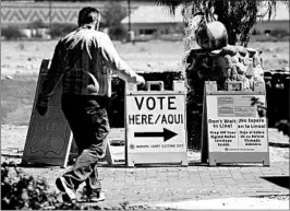  ?? RALPH FRESO/GETTY ?? An Arizona voter makes his way to a polling place to cast his vote Tuesday in Phoenix.