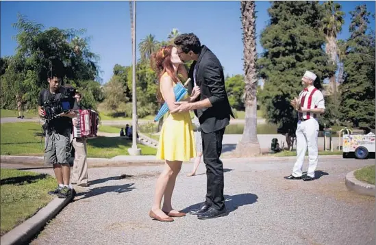  ?? Jenna Schoenefel­d
For The Times ?? A PASSIONATE SCENEunfol­ds in Boyle Heights’ Hollenbeck Park featuring Sarah Beaty and Victor Mazzone and their casually staged musical accompanim­ent.