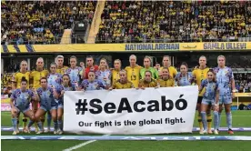  ?? Jonathan Nackstrand/AFP/Getty Images ?? The Spain and Sweden players join forces to deliver their message before the game. Photograph: