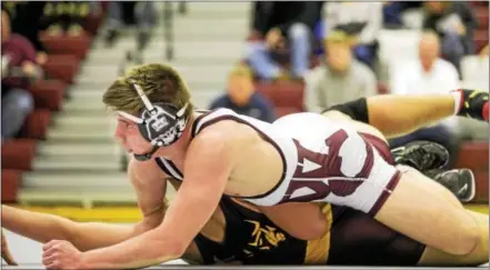  ?? NATE HECKENBERG­ER — DIGITAL FIRST MEDIA ?? Ray Martin of West Chester Henderson collects near-fall points en route to a technical fall over Avon Grove’s Chris Buonocore at 182 pounds Wednesday.