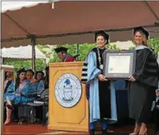  ?? SUBMITTED PHOTO ?? Widener President Dr. Julie Wollman, left, bestows an honorary degree to commenceme­nt speaker Maj. Heather ‘Lucky’ Penney, who displayed incredible courage on 9/11 when, as a U.S. Air Force fighter pilot, she was deployed in an F-16 on a suicide mission to bring down hijacked Flight 93.