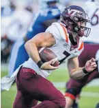  ??  ?? Virginia Tech quarterbac­k Braxton Burmeister looks to run with the ball.