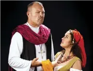  ?? PETER SWANZY photo ?? Will Kimball (left) as Frollo lusts for Danielle Mealani Delaunay’s Esmeralda in “The Hunchback of Notre Dame The Musical.”