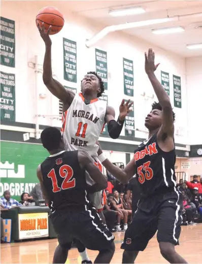  ??  ?? Morgan Park’s Ayo Dosunmu puts up a shot over Bogan’s Jerome Bynum ( 12) and Rashaun Agee. | WORSOM ROBINSON/ FOR THE SUN- TIMES