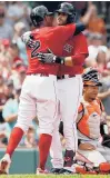  ?? MICHAEL DWYER/AP ?? J.D. Martinez, center, celebrates his three-run home run that also drove in Red Sox teammate Xander Bogaerts against the Orioles in the first inning Sunday in Boston.