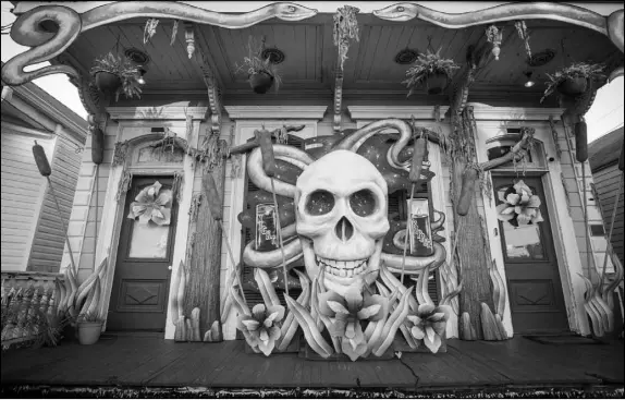 ?? L. KASIMU HARRIS / THE NEW YORK TIMES ?? An ominous skull is the centerpiec­e of a home in New Orleans decorated as a Mardi Gras f loat, with the annual festivitie­s canceled due to the pandemic. Louisiana, which has the nation’s highest murder rate, has problems common to several Southern states, like a high rate of poverty, but it also has an inheritanc­e of violence.