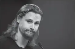  ?? Canadian Press photo ?? Erik Karlsson talks to media during the Ottawa Senators first day of hockey training camp in Ottawa on Thursday.