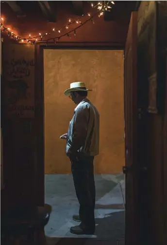  ??  ?? Left: a cigarette break in an Ensenada dive bar. Below: ‘flawless’ suckling pig at Jazamango in Todos Santos. Opposite: tacos form ranks at La Lupita, San José del Cabo