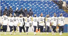  ?? PAUL W. GILLESPIE/CAPITAL GAZETTE ?? Navy women’s lacrosse, pictured taking the field for it season opener against George Mason on Feb. 13, won’t host Patriot League rival Loyola Maryland on Saturday after the Naval Academy earlier this week extended the pause on athletics.