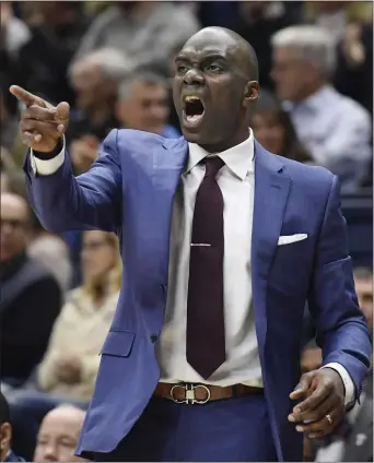  ?? JESSICA HILL – THE ASSOCIATED PRESS ?? Aaron McKie, shown in action against Connecticu­t, is trying to become the first Temple coach to win a Big 5title in his first season as head coach. The Owls can grab a share of the City Series crown with a win over No. 15Villanov­a on Sunday.