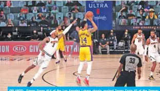  ??  ?? ORLANDO: Danny Green #14 of the Los Angeles Lakers shoots against Torrey Craig #3 of the Denver Nuggets as part of the NBA Restart 2020 at AdventHeal­th Arena at ESPN Wide World of Sports Complex in Orlando, Florida. — AFP