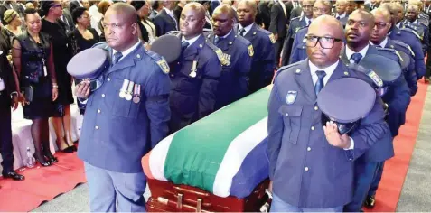  ??  ?? POLICE officers act as pallbearer­s at late businessma­n Richard Maponya’s funeral service at the University of Johannesbu­rg’s Soweto Campus yesterday.