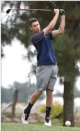  ??  ?? Monache High School's Austin Thompson starts off hole No. 6 Tuesday, May 1, during the EYL championsh­ip tournament at Tulare Golf Course.
