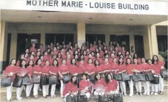  ??  ?? RUBY GROUP.
Ladies of St. Theresa’s College High School Class 1979, trendy in their red and white outfits matched with black bags.