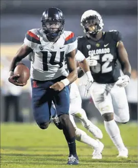  ?? David Zalubowski Associated Press ?? ARIZONA’S Khalil Tate set a quarterbac­k record by rushing for 327 yards against Colorado last month. He has also completed 68.7% of his passes.