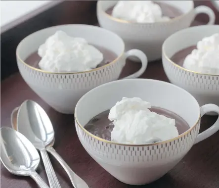  ?? GWENDOLYN RICHARDS/ CALGARY HERALD ?? Chocolate pudding, with a dollop of whipped cream, is luscious.