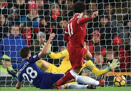  ??  ?? RED PERIL: Salah slots home to give Liverpool the lead but they couldn’t see it out as Willian struck late on for Chelsea