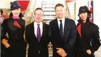  ??  ?? AUSTRALIA: A handout photo shows Australian cricket captain Michael Clarke (second right), Qantas CEO Alan Joyce (second left) and two flight attendants on the steps of a Qantas A380 plane at an official farewell event as the Australian cricket team...