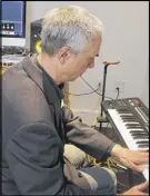  ?? LYNN CURWIN/TRURO DAILY NEWS ?? Bill Morgan, administra­tor of automated and technical services, tries out the midi keyboard in the media lab at the Truro library. The lab can be booked by anyone with a library card, once they have gone through a brief orientatio­n.