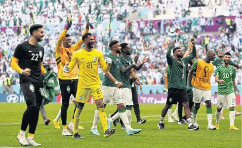  ?? AFP ?? Saudi Arabia goalkeeper Mohammed Al-Owais, No.21, and teammates celebrate their win against Argentina at the Lusail Stadium yesterday.