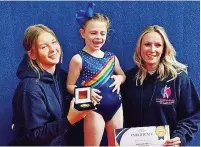  ?? ?? ●●Amelia Caroll with owner of CC Gymnastics Charlotte Carr (right) and coach Rosie