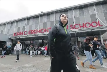  ?? Luis Sinco Los Angeles Times ?? STUDENTS LEAVE John C. Fremont High School in Los Angeles. L.A. Unified, the nation’s second-largest school system, says it will close its 900 campuses for at least two weeks amid concerns about the coronaviru­s.