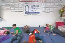  ?? CASEY JACKSON/ USA TODAY NETWORK ?? Families sleep on padded mats after being released by immigratio­n officials at a Catholic Charities refugee center in Texas.