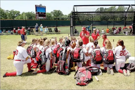  ?? MARK HUMPHREY ENTERPRISE-LEADER ?? Farmington head coach Randy Osnes and assistant Steve Morgan with volunteer assistant Kelby Osborn talk to the softball team in the aftermath of a 3-2 loss to Greenbrier in Saturday’s 5A State championsh­ip game played at the Benton Sports Complex in...