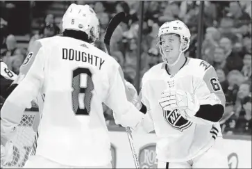  ?? Chris O'Meara Associated Press ?? RICKARD RAKELL, right, of the Ducks is congratula­ted by Drew Doughty of the Kings after scoring for the Pacific Division All-Stars. Rakell led the Pacific team to victories over the Central and Atlantic divisions.