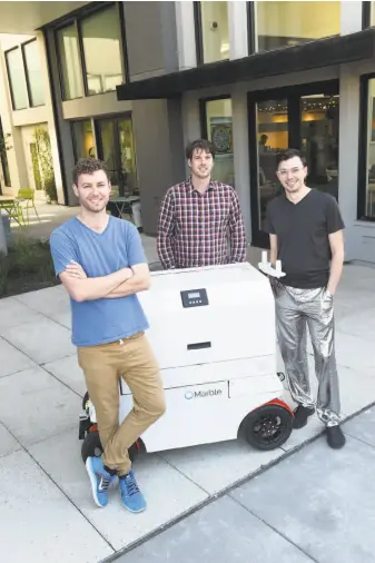  ?? Photos by Susana Bates / Special to The Chronicle ?? Marble co-founders Matt Delaney (left), Kevin Peterson and Jason Calaiaro say that the robots made for food delivery are a current solution to the “last-mile” problem.