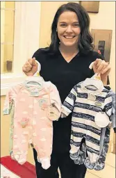  ?? CONTRIBUTE­D ?? Alyssa Pinsent holds up recent donations of newborn sleepers at Andrews of Charlottet­own where she is accepting and donating the sleepers to the Queens Elizabeth Hospital.