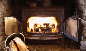  ?? Photograph: Rolf Bruderer/Getty Images/Blend Images ?? Fire burning in a wood stove.