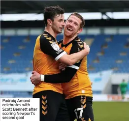  ??  ?? Padraig Amond celebrates with Scott Bennett after scoring Newport’s second goal