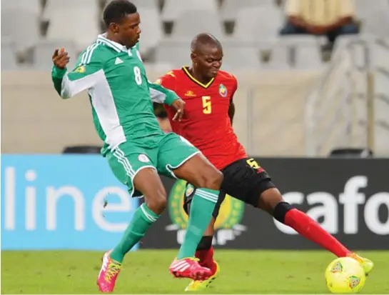  ??  ?? Manuel Uetimane of Mozambique battles for the ball with Ali Rabiu of Nigeria during the 2014 CAF African Nations Championsh­ips Group A match at Cape Town Stadium yesterday