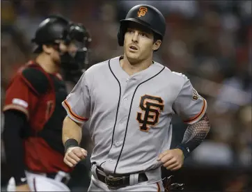  ?? PHOTOS BY RICK SCUTERI — THE ASSOCIATED PRESS ?? Mike Yastrzemsk­i scores the Giants’ only run of Sunday’s game following a single by Scooter Gennett in the sixth inning.