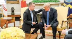  ?? — AFP ?? Freed pastor Andrew Brunson prays for President Donald Trump at the White House in Washington, DC, on Saturday.