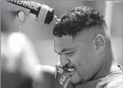  ?? ?? ATONIO MAFI tries to cool down at the Rose Bowl, where the Bruins drew an all-time low of 27,143 fans.