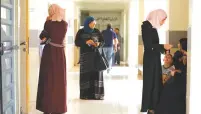  ?? (Amir Cohen/Reuters) ?? BEDOUIN WAIT to vote yesterday in Rahat.