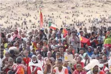  ?? — AFP ?? Ethiopian refugees gather to celebrate the 46th anniversar­y of the Tigray People’s Liberation Front at Um Raquba refugee camp in Gedaref, eastern Sudan.