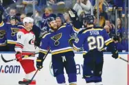  ??  ?? St. Louis Blues center Ryan O’Reilly (90) celebrates with left wing Alexander Steen (20) after scoring an empty net goal for his first career hat trick during the third period against the Carolina Hurricanes at Enterprise Center. PICTURE: Jeff Curry-USA TODAY Sports