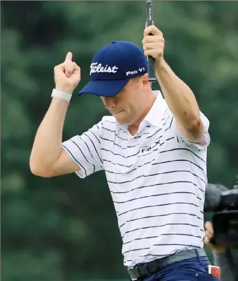  ?? Sam Greenwood/Getty Images ?? Justin Thomas reacts to chipping in on No. 14 Saturday en route to a course-record 61 in the third round of the BMW Championsh­ip at Medinah Country Club in Medinah, Ill.