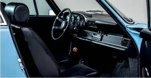  ??  ?? Below 917-style gear knob cuts through the black carpets, seats and dashboard